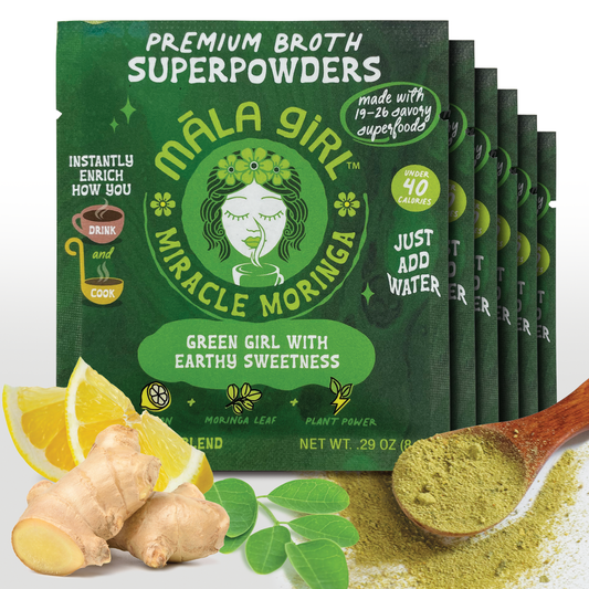Māla Girl Broths Miracle Moringa Superfood Broth powder in a clear container with a scoop, ready for cooking or adding to recipes.